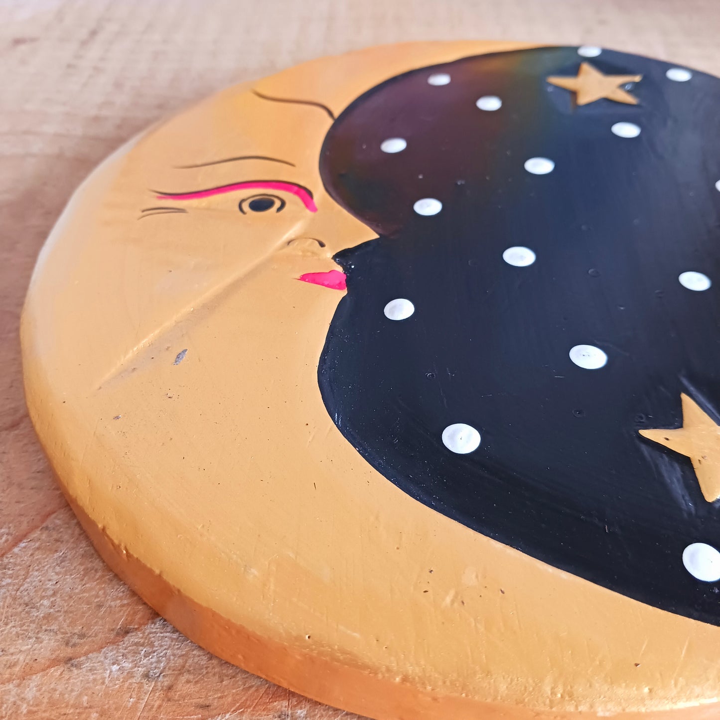 Bring celestial charm and mystical elegance into your space with this Black and Gold Moon Plaque. Hand-carved by skilled Balinese artisans from sustainably sourced wood, this stunning wall piece pairs the gentle energy of the moon with a dramatic black and gold colour palette.