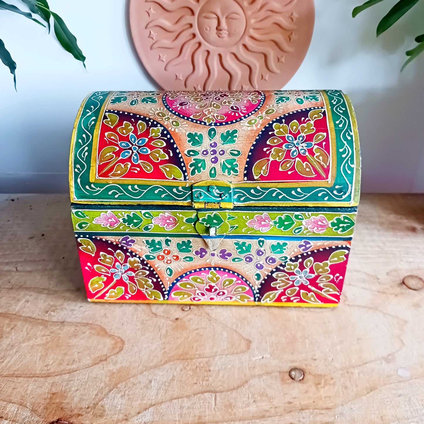 Add a vibrant touch to your home décor with this beautiful handmade domed wooden box, expertly crafted and hand painted in a striking lime and pink floral pattern. Featuring a hinged domed lid and secure front closure, this decorative storage box combines traditional craftsmanship with eye-catching design.