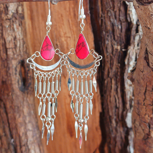 Add a touch of bohemian beauty to your look with these handmade Peruvian stone earrings. Featuring red stones and finished with silver-plated hooks, each pair is carefully crafted in small workshops in Peru.