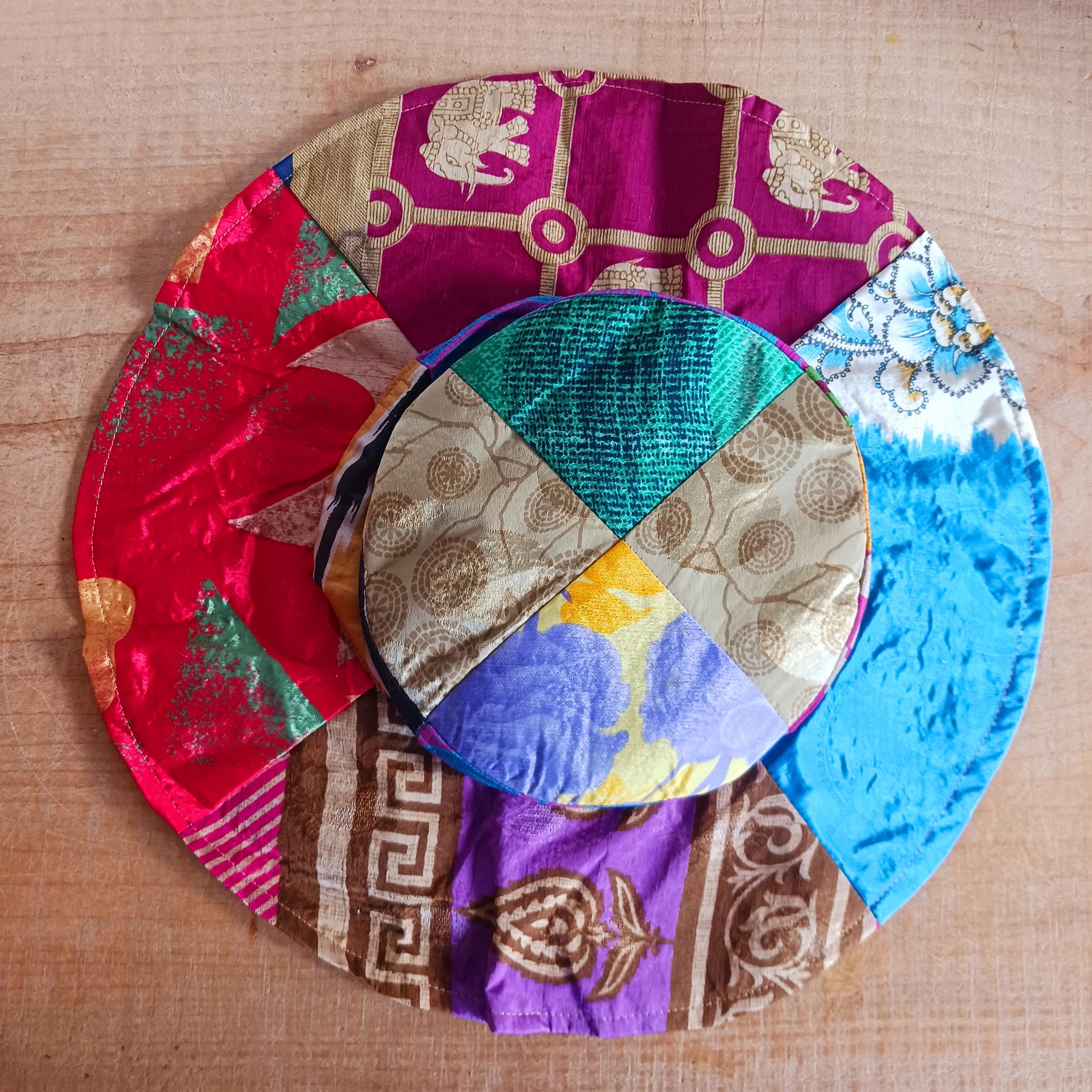 This colourful sunhat is made from patches of remnants from saris. Each hat is unique and features a wide brim to keep the sun from your face and keep you cool, lined with plain cotton to keep you even cooler. These hats are lightweight so easy to carry around in your bag. Ideal for travelling and festivals.