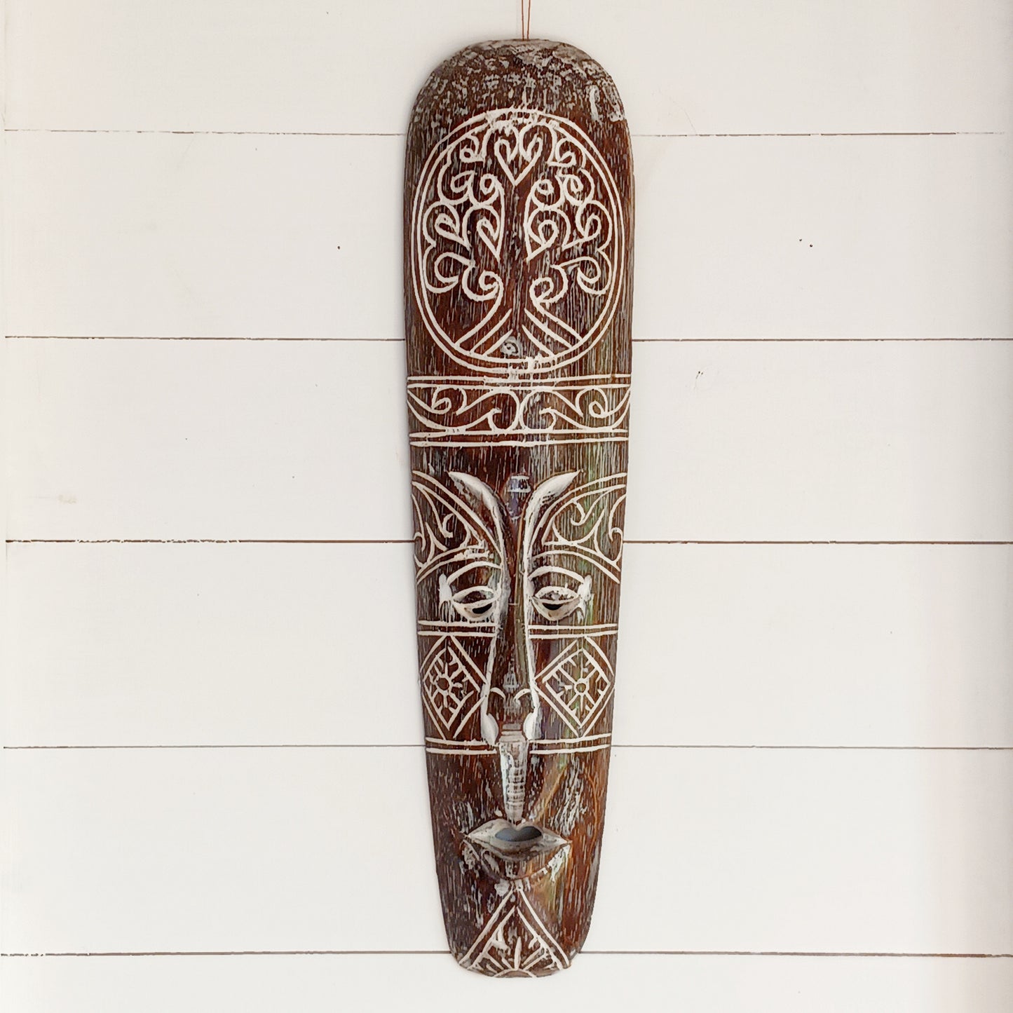 Bring the spirit of Celtic heritage into your home with this beautifully hand-carved Celtic wooden mask, featuring intricate knotwork and a Tree of Life pattern that symbolize eternity, unity, and tradition. Designed for lovers of cultural art and meaningful decor, this striking wall piece adds depth, character, and history to any space.