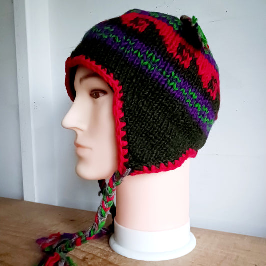 Stay cozy and stylish with our handmade chunky wool earflap hats, crafted in Nepal by skilled women artisans in Kathmandu. Each hat is 100% pure wool and features a soft polar fleece lining for extra warmth and comfort. Perfect for cold winter days, outdoor adventures, or adding a touch of handmade charm to your look.
