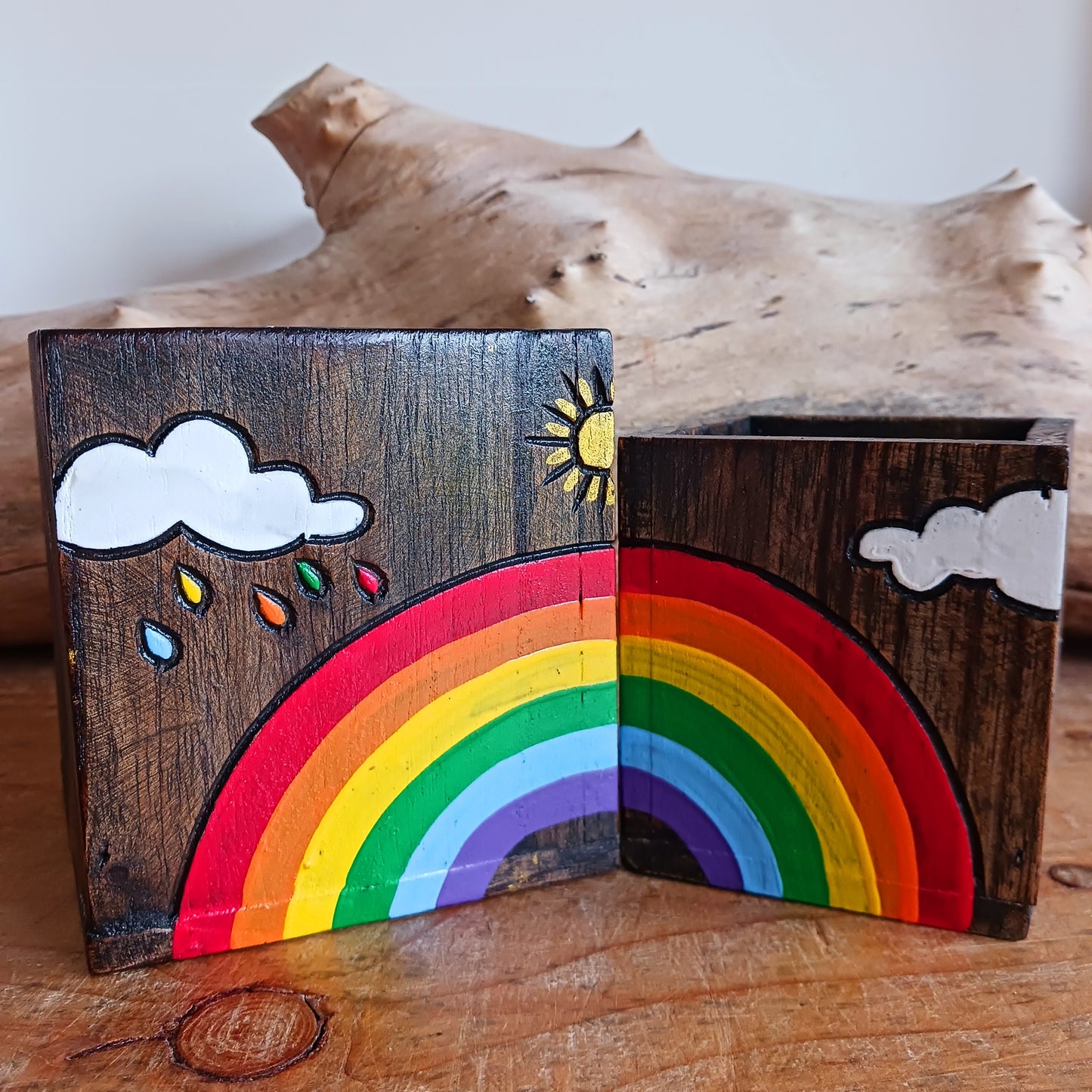 Add a burst of colour and joy to your space with this Hand Painted Rainbow Wooden Pots Set, handmade in Indonesia and Fairtrade certified. Each pot is carefully painted by skilled artisans, making every set unique and full of character.