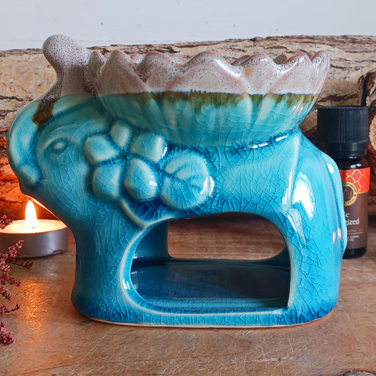 This cute Elephant ceramic burner is for aromatic wax melts or essential oils.