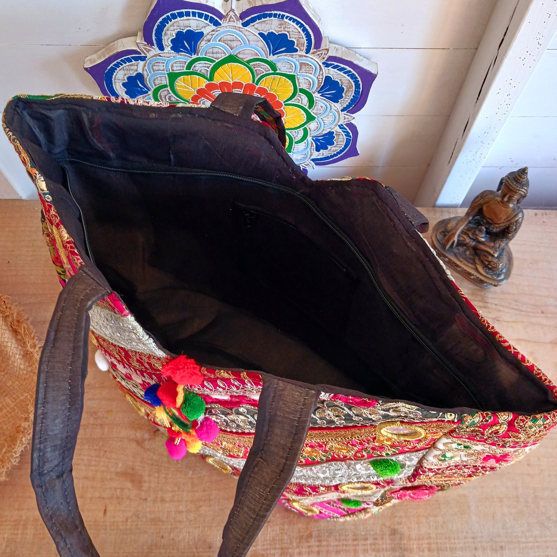 This beautiful large Indian bag comes with a wide shoulder strap and plenty of space inside for your personal items. In a patchwork style design, this bag is intricately embroidered with a traditional bohemian pattern. The bag is fully lined throughout.
