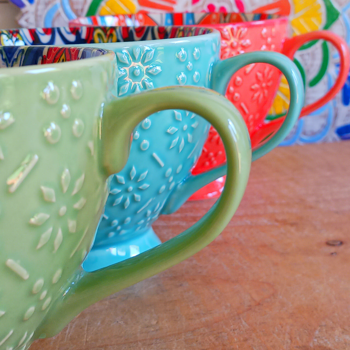 Bring the warmth and colour of the Mediterranean into your home with this beautiful Tuscany-inspired ceramic mug. Featuring a vibrant glazed exterior and an eye-catching embossed geometric pattern inside, this stylish mug is inspired by the rustic terracotta tiles and intricate murals found in sun-soaked Italian villages.