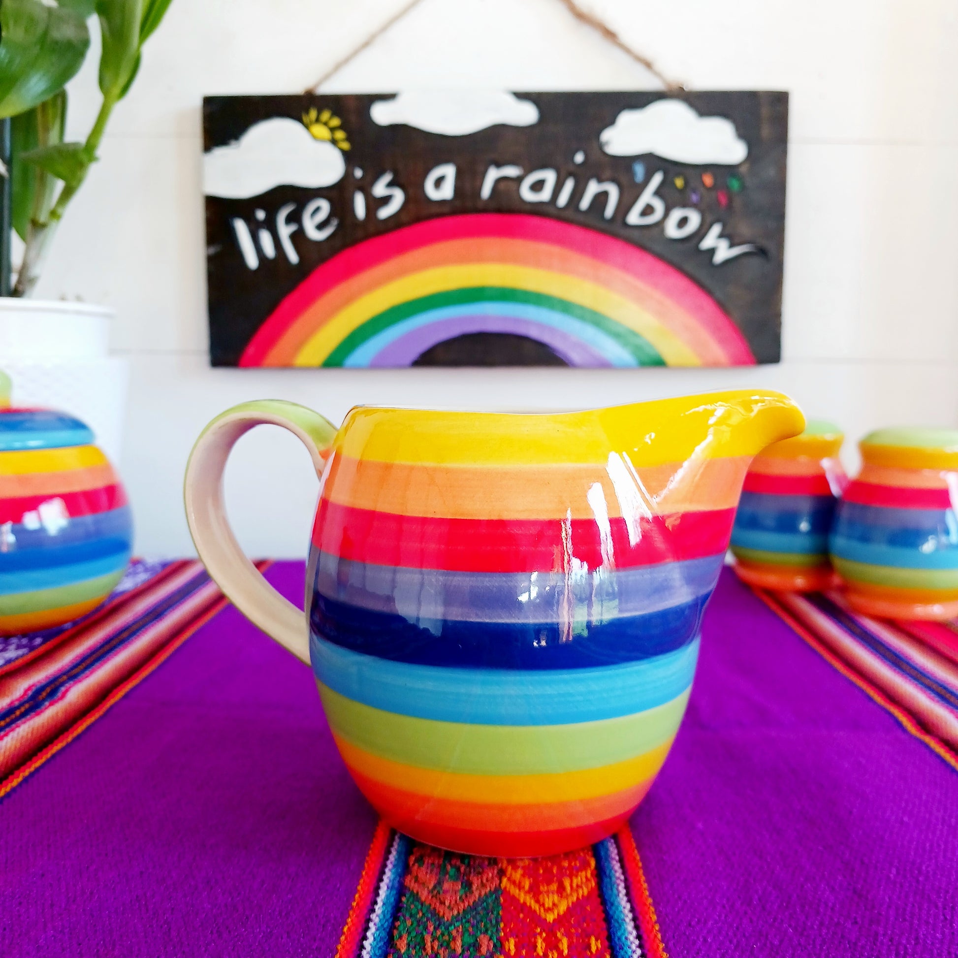 This rainbow stripe ceramic milk jug will brighten up any home. The vibrant stripes are hand painted giving each piece individual character.