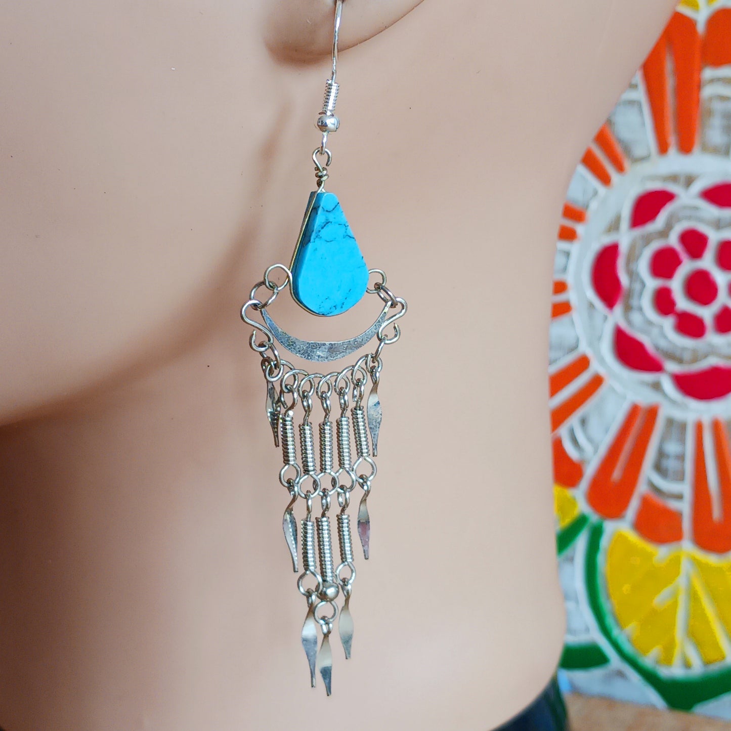 Add a touch of bohemian beauty to your look with these handmade Peruvian stone earrings. Featuring turquoise stones and finished with silver-plated hooks, each pair is carefully crafted in small workshops in Peru.