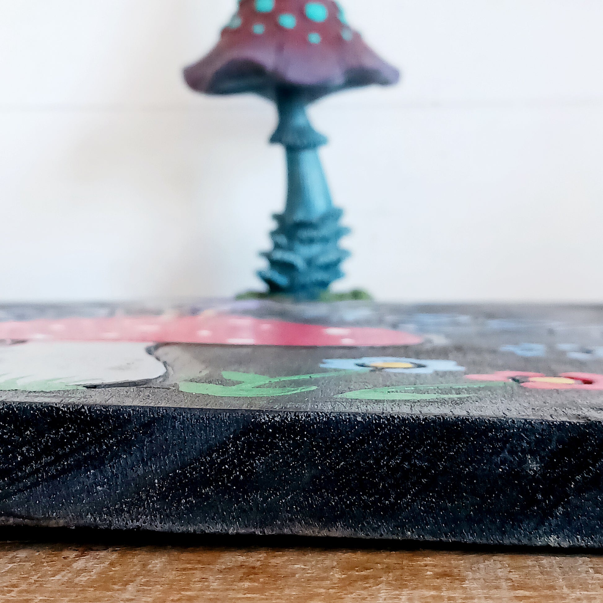 Bring a touch of enchantment to your home with this Fairy Magic Handmade Wall Plaque. Beautifully crafted and hand-painted, it features a delightful fairy resting among whimsical mushrooms, perfect for adding charm and colour to any space. Whether displayed indoors or outdoors, this rustic fairy wall art will brighten your surroundings and spark a little magic every day.