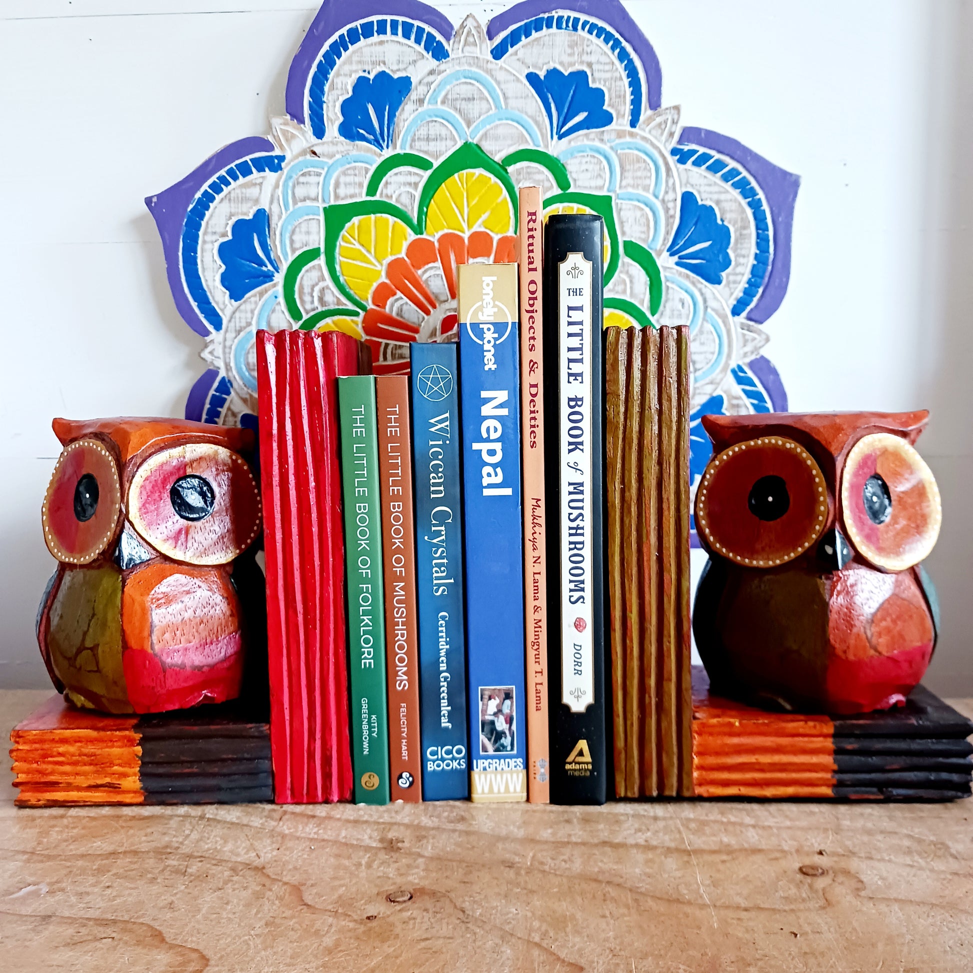 Add a touch of fun and charm to your bookshelf with these beautifully hand painted wooden owl bookends. These lovely bookends are designed to keep your books neatly organised, and the owls feature intricate detailing and colour that will bring personality and warmth to any space in your home.