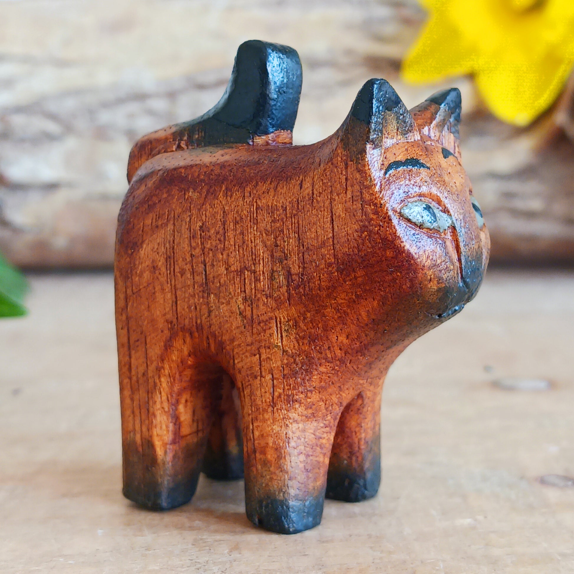 Bring warmth and charm to your home with this hand carved rustic mini cat, a delightful wooden figurine full of personality. Carefully crafted from Jempinis wood, each tiny cat is individually carved by skilled artisans in Indonesia and finished with subtle painted details that give every piece its own unique character.