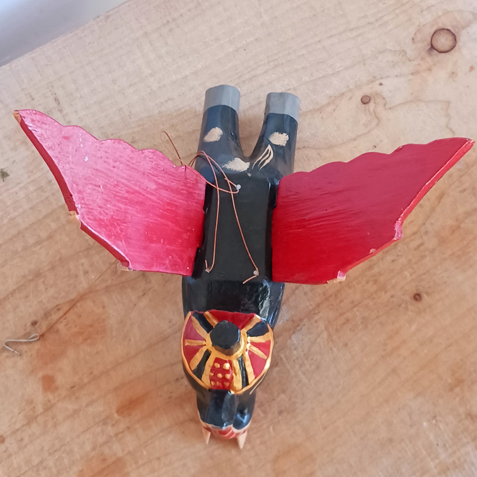 Bring a touch of wonder to your space with this enchanting Flying Elephant Mobile. Each piece is hand-carved from lightweight wood and finished with unique hand-painted patterns, giving every elephant its own personality. Delicately balanced wings hover gracefully with the slightest breeze, creating a calming sense of motion and magic.