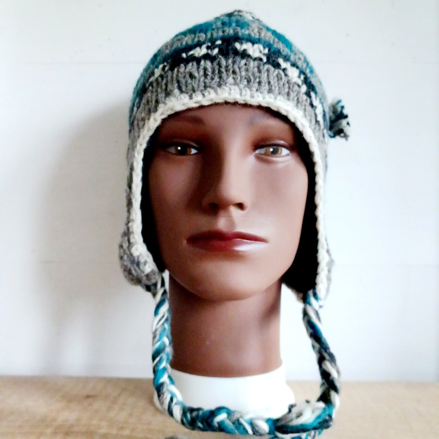 Stay cozy and stylish with our handmade chunky wool earflap hats, crafted in Nepal by skilled women artisans in Kathmandu. Each hat is 100% pure wool and features a soft polar fleece lining for extra warmth and comfort. Perfect for cold winter days, outdoor adventures, or adding a touch of handmade charm to your look.