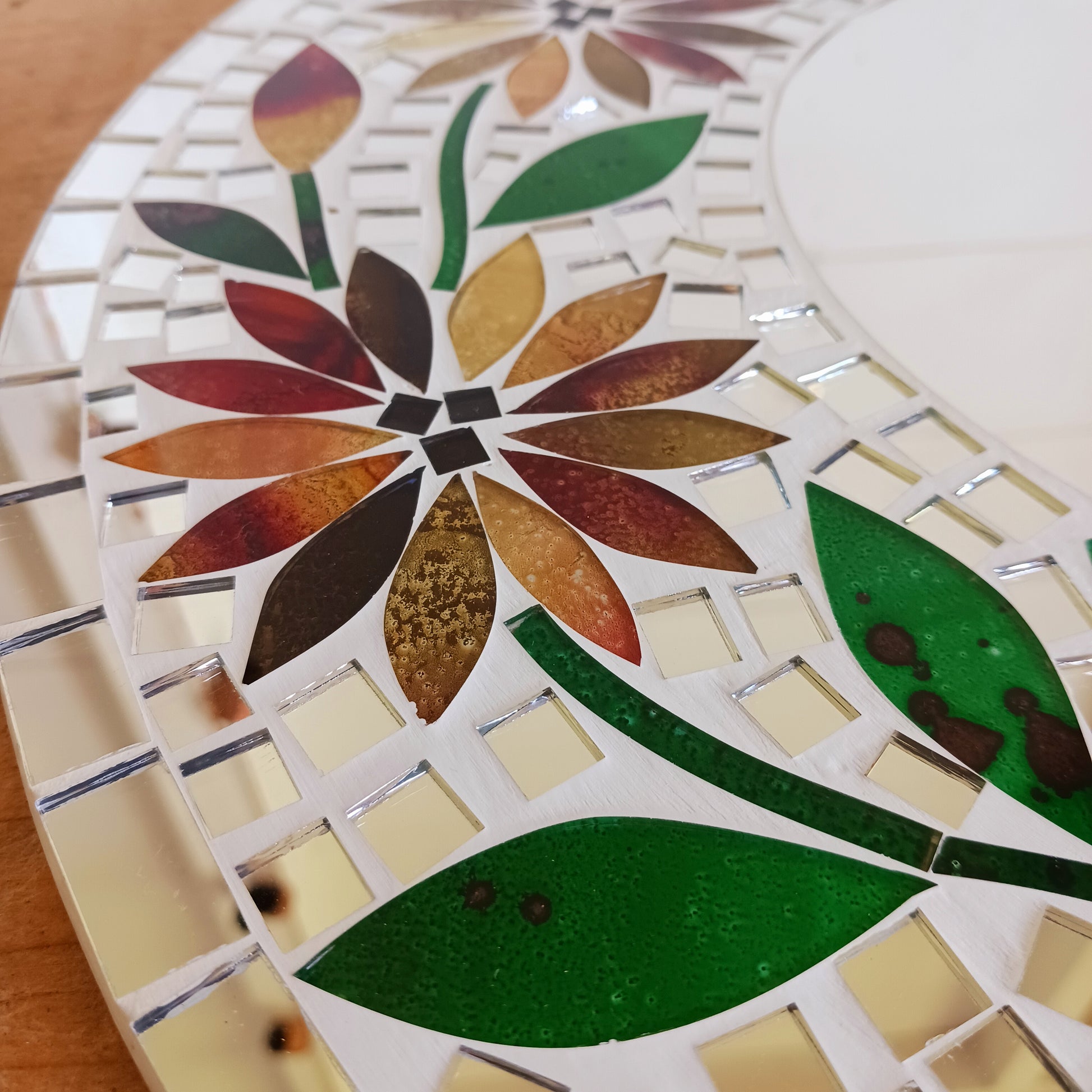 Transform any room into a vibrant oasis with our large Handmade Mosaic Floral Mirror. Crafted with care, this stunning mirror features a bright floral mosaic design that instantly adds style and colour to your décor. Perfect as a statement piece for living rooms, bedrooms, hallways, or entryways, it reflects not only light but also personality. Each mirror is uniquely handmade, making it a one-of-a-kind addition to your home.