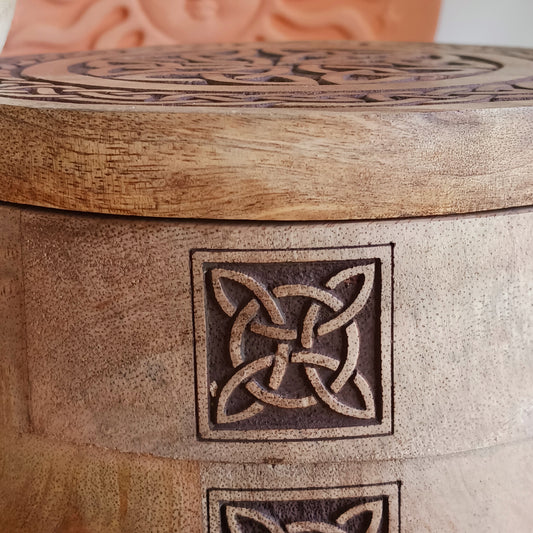 Bring timeless craftsmanship and functional beauty into your space with this Celtic Carved Revolving Storage Box, expertly hand-crafted from sustainable mango wood. Designed with both elegance and practicality in mind, this unique 3-tier swivel box opens smoothly from a central pivot, revealing three spacious compartments that fan out effortlessly.