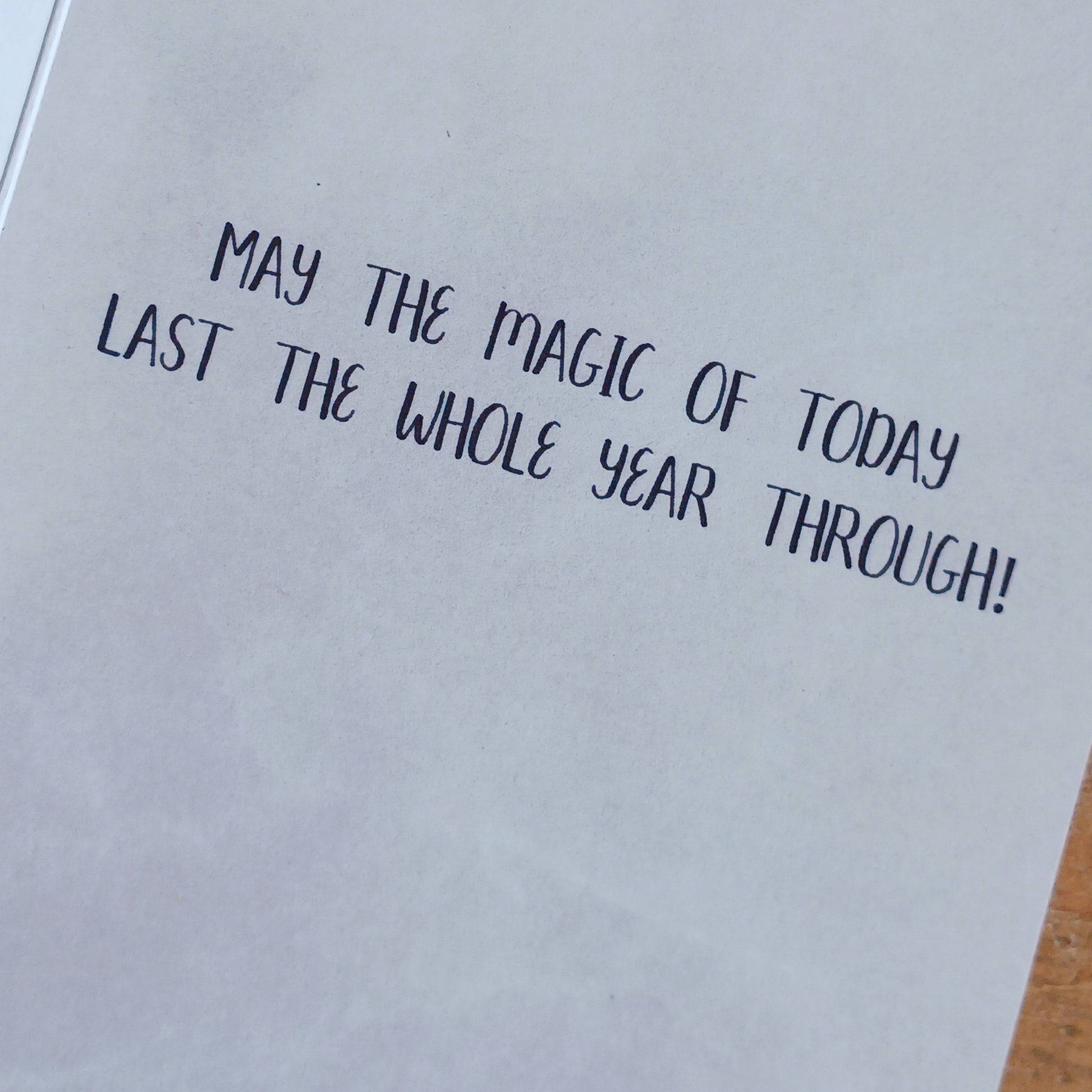 Magical wishes greetings card for birthday. Inside the message reads: May the magic of today last the whole year through!  The card comes with an illustrated envelope. Each card also has faint artwork inside.