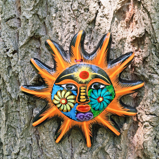 This sunny and vibrant wall plaque will get you smiling! It has been beautifully hand painted in a bright style traditional to Xalitla, a region of Guerrero, Mexico. A striking glaze adds to the bold design. It has two holes which can be used to add a hanging loop for an easy display.