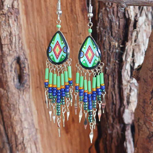 Add a touch of artisan elegance to your jewellery collection with these stunning handmade Peruvian Incan teardrop earrings. Carefully crafted in small family-run workshops in Peru, these eye-catching earrings feature traditional Incan-inspired patterns on the front with a contrasting black reverse for a striking finish.