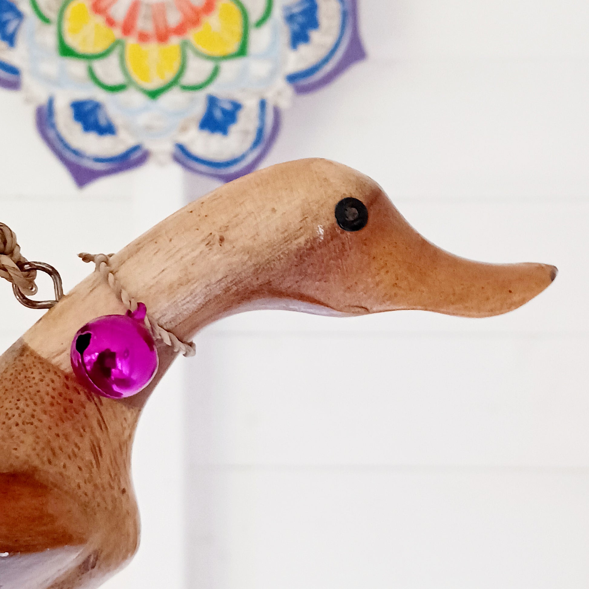 Bring a touch of whimsy and natural beauty to your home with this Handcarved Wooden Flying Duck. Each piece is meticulously crafted from solid wood, showcasing the artisan’s skill and attention to detail. The duck’s natural finish highlights the unique wood grain, adding a rustic charm that complements any interior style.