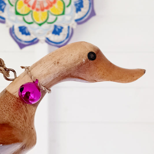 Bring a touch of whimsy and natural beauty to your home with this Handcarved Wooden Flying Duck. Each piece is meticulously crafted from solid wood, showcasing the artisan’s skill and attention to detail. The duck’s natural finish highlights the unique wood grain, adding a rustic charm that complements any interior style.
