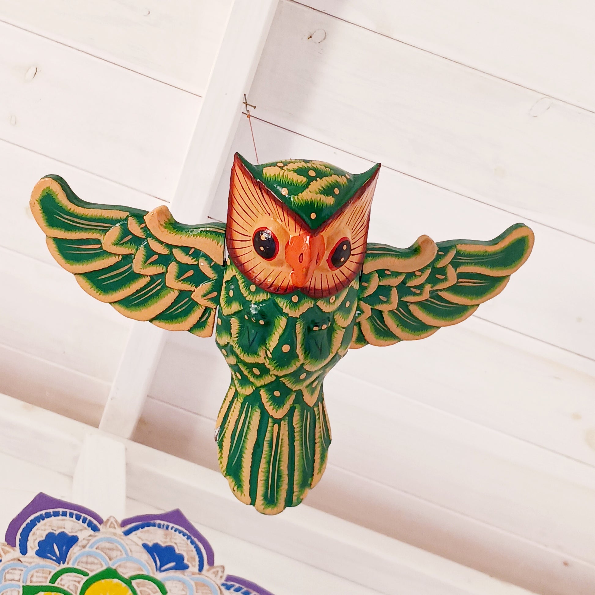 Bring a sense of peace and wonder to your space with this Hand-Carved Wooden Flying Owl Mobile. Each piece is lovingly crafted from natural wood, featuring a beautifully detailed owl with outstretched wings in graceful flight. Suspended from a delicate string, the owl moves gently with the breeze, creating a calming, soothing motion.