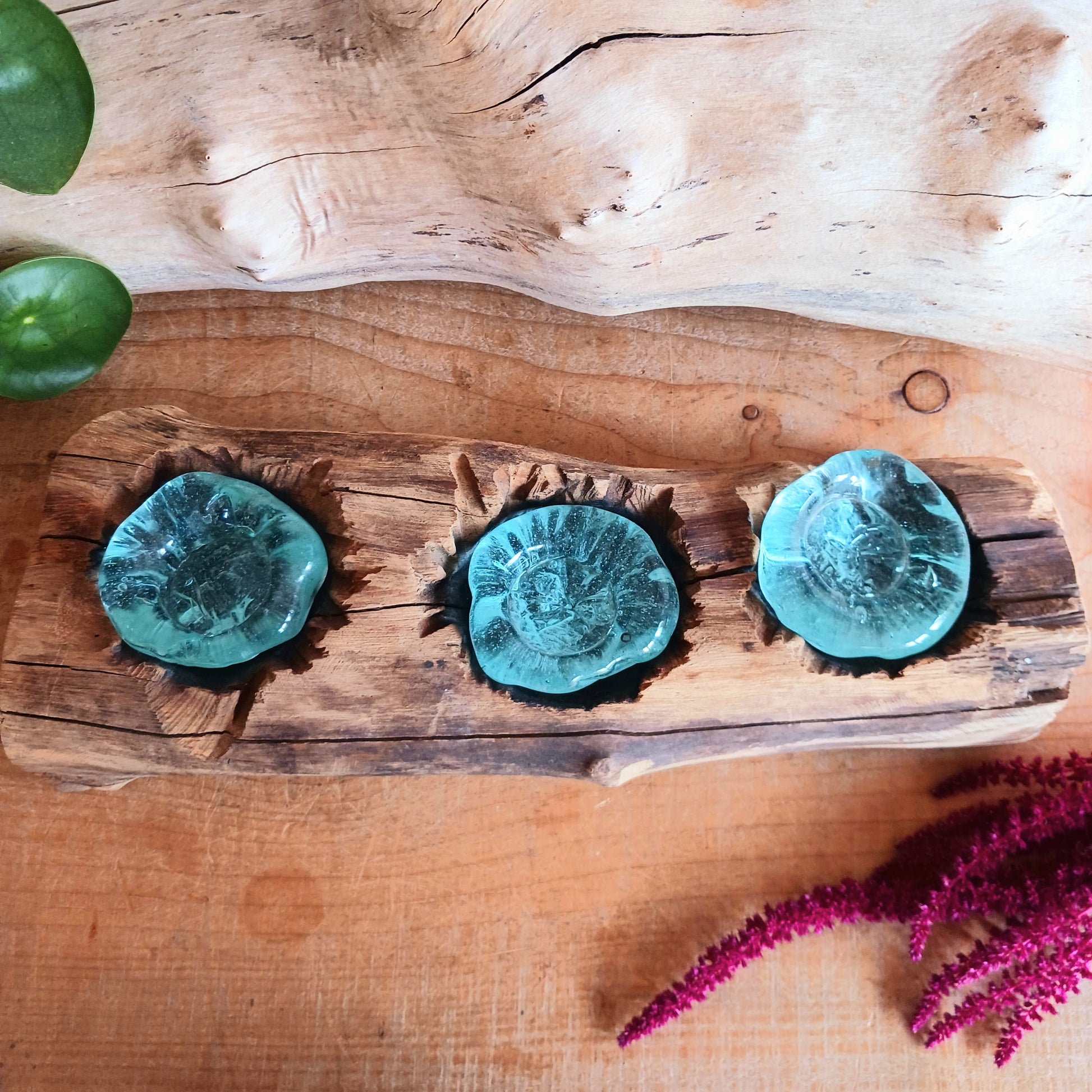 Bring nature into your home with this stunning handmade melted glass candle holder crafted in Bali. Each piece is truly one-of-a-kind, made from recycled glass hand-blown over whitewashed Balinese Gamal wood. As the molten glass cools, it moulds perfectly to the shape of the natural wood root, creating a unique balance of earthy and chic design. 