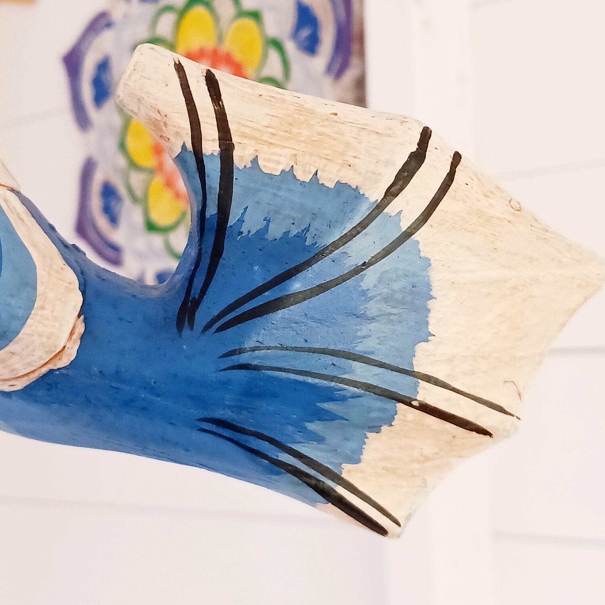 Bring a touch of fantasy to your home with this beautifully handcrafted winged seahorse hanging mobile. Hand-painted in vivid cobalt blue, this enchanting wooden seahorse features intricate painted scales, feather-like detailing and traditional Balinese-inspired decoration.