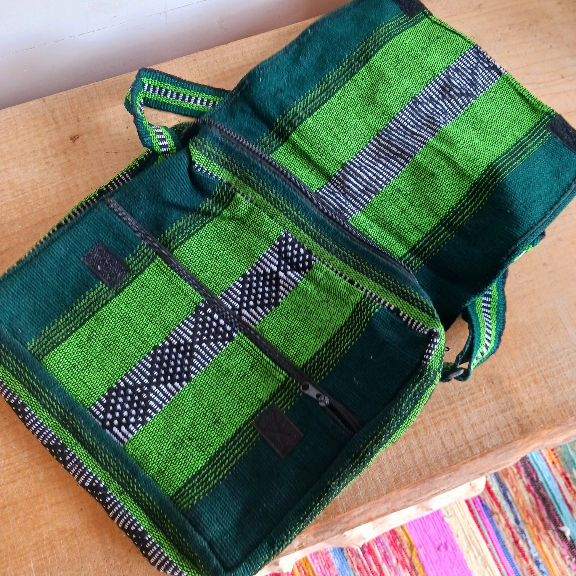 Inspired by the Spanish word for "colourful," this Vistoso Satchel brings vibrant style and practical design together. Available in a variety of bold and eye-catching patterns, this satchel comes in lovely shades of green and is both fashionable and functional. The spacious main zipped compartment comfortably fits a small laptop or notebook, while the additional front zipped pocket keeps essentials within easy reach.
