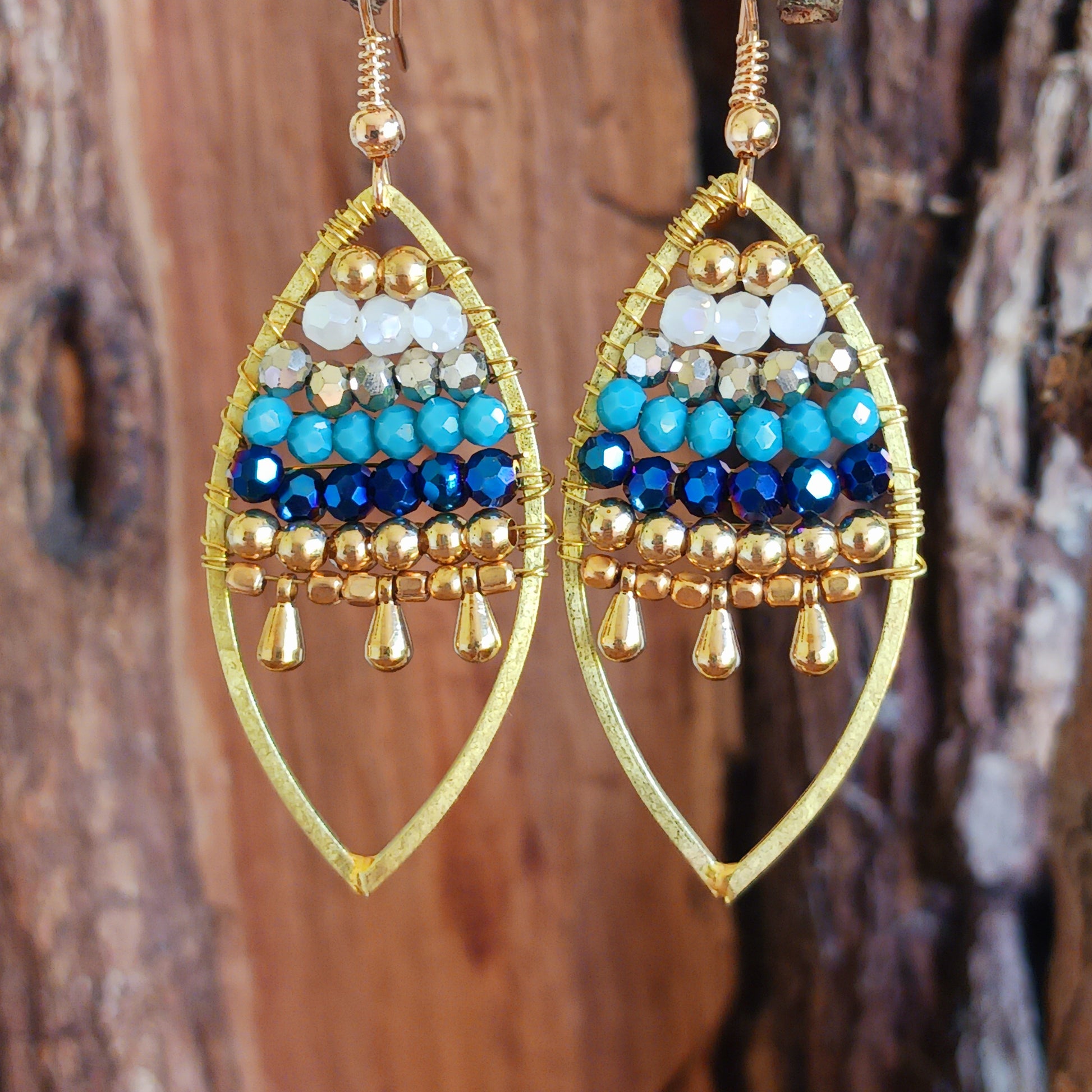 These pretty beaded earrings are so bohemian chic and add effortless style to your outfit. The beads sparkle gently when the light catches them, making them a great evening accessory as well as daytime. They are finished with gold plated hooks.