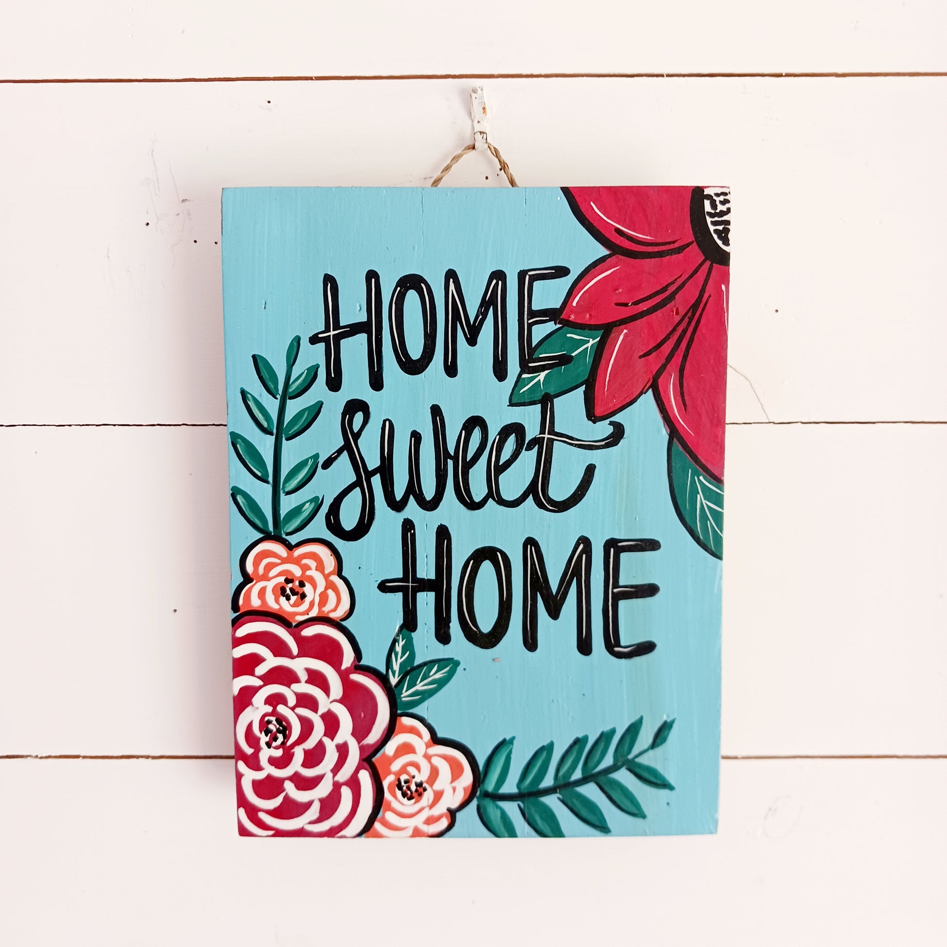Add warmth and personality to your home with this beautiful Hand Painted Home Sweet Home Wall Plaque. Featuring a vibrant, colourful design and carefully hand-painted finish, this decorative wall plaque is a charming addition to any living room, hallway, kitchen, or entrance.