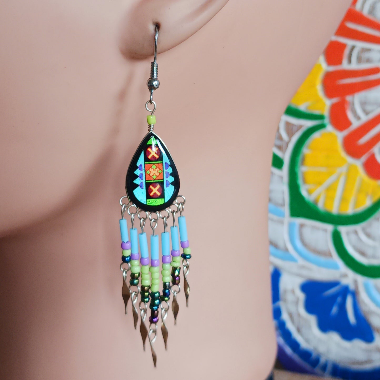 Add a touch of artisan elegance to your jewellery collection with these stunning handmade Peruvian Incan teardrop earrings. Carefully crafted in small family-run workshops in Peru, these eye-catching earrings feature traditional Incan-inspired patterns on the front with a contrasting black reverse for a striking finish.