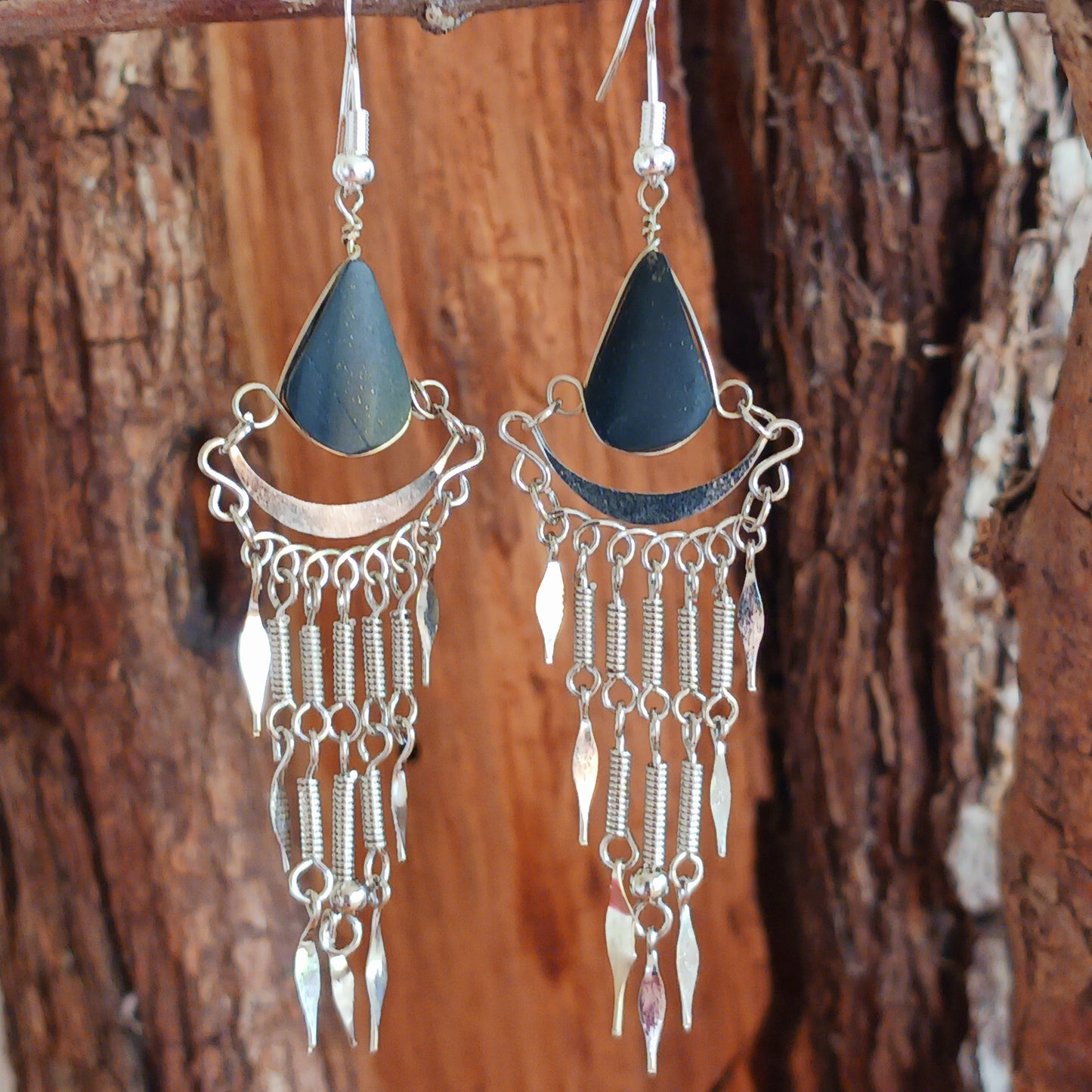 Add a touch of bohemian beauty to your look with these handmade Peruvian stone earrings. Featuring black stones and finished with silver-plated hooks, each pair is carefully crafted in small workshops in Peru.