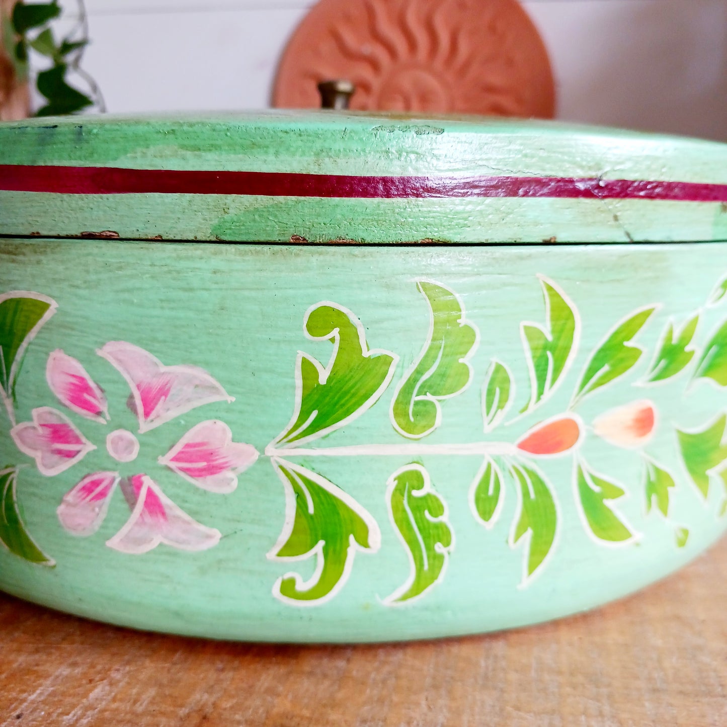 Bring a touch of traditional Indian craftsmanship to your home with this beautiful Handmade Indian Wooden Peacock Decorative Box. Expertly crafted from wood and hand-painted by skilled artisans, this charming round storage box features an elegant peacock design on the pull-off lid, symbolizing beauty, grace, and prosperity.
