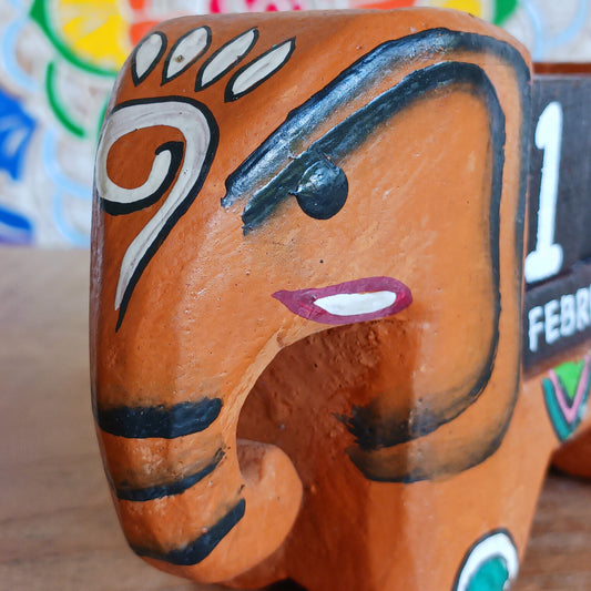 Brighten up your desk with this charming hand-painted wooden elephant calendar! This cheerful desk-buddy is both practical and eco-friendly, making it a perfect addition to your work or study space. Simply rotate the wooden blocks each day to keep track of the date – no need to replace it year after year. A thoughtful, sustainable gift for elephant lovers, students, or anyone who enjoys unique handcrafted décor.