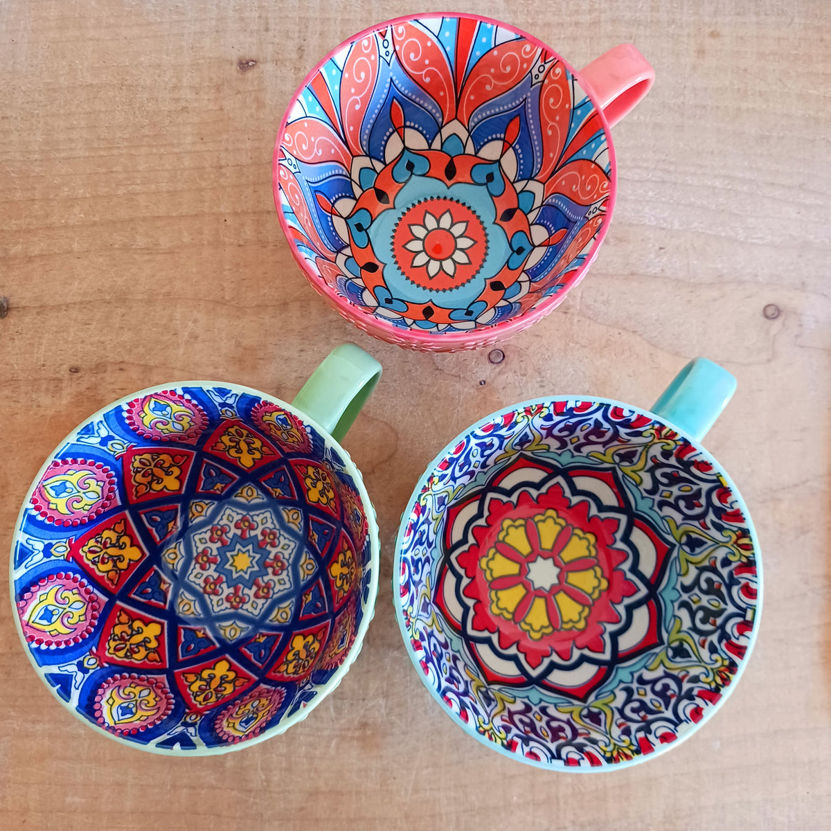 Bring the warmth and colour of the Mediterranean into your home with this beautiful Tuscany-inspired ceramic mug. Featuring a vibrant glazed exterior and an eye-catching embossed geometric pattern inside, this stylish mug is inspired by the rustic terracotta tiles and intricate murals found in sun-soaked Italian villages.