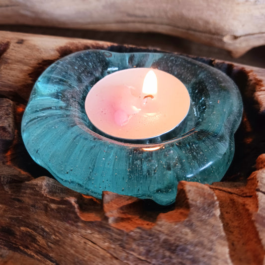 Bring nature into your home with this stunning handmade melted glass candle holder crafted in Bali. Each piece is truly one-of-a-kind, made from recycled glass hand-blown over whitewashed Balinese Gamal wood. As the molten glass cools, it moulds perfectly to the shape of the natural wood root, creating a unique balance of earthy and chic design. 