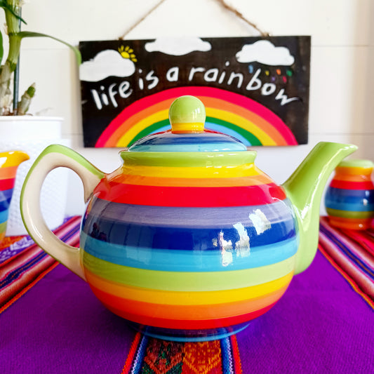 Experience the perfect fusion of artistry and functionality with this exquisite 2-cup ceramic teapot from Thailand. Handcrafted by skilled artisans, this vibrant teapot features a stunning rainbow stripe, adding a pop of colour and charm to your tea rituals.