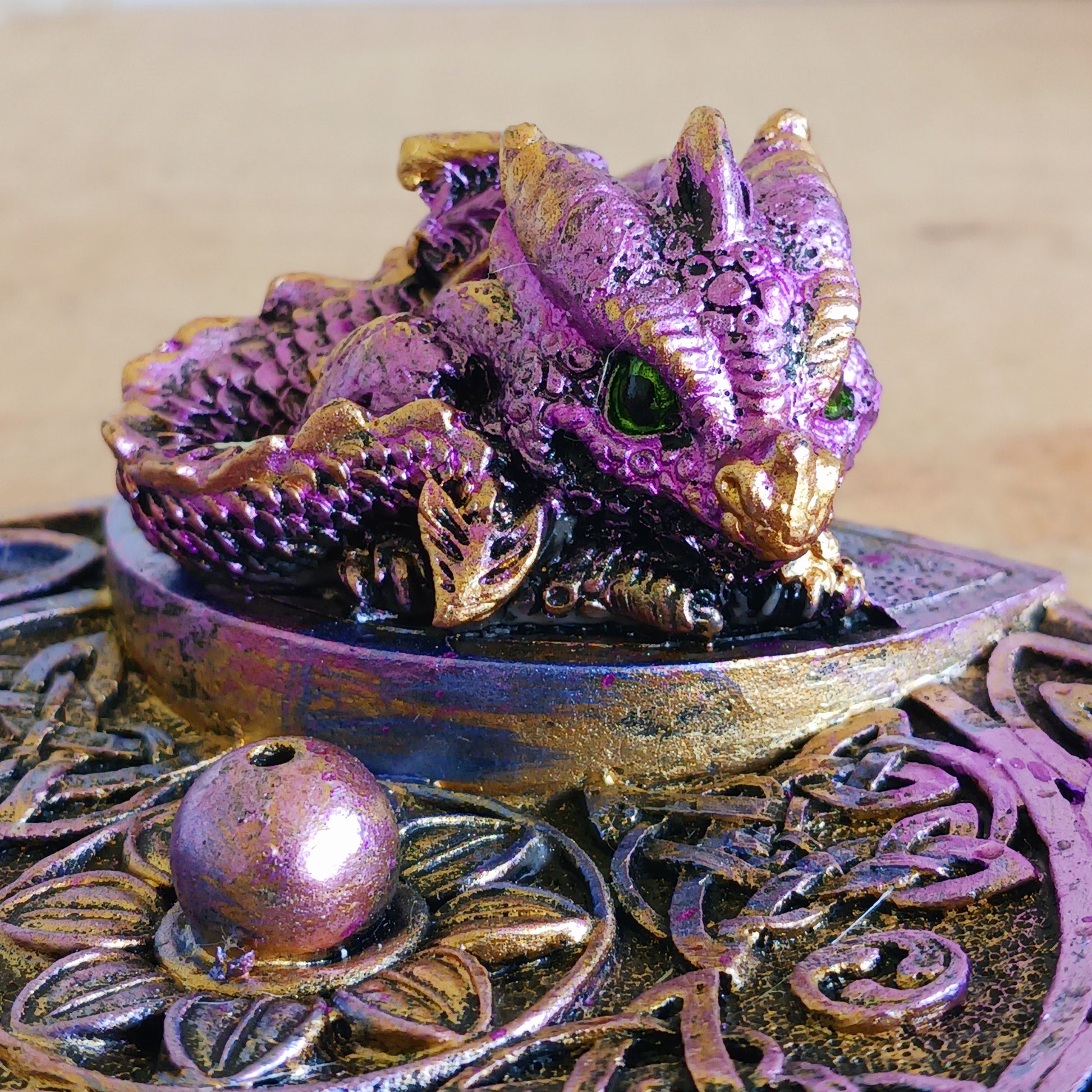 Embrace mystical vibes with this enchanting Celtic dish incense holder featuring a whimsical baby dragon. Crafted with intricate detail, the baby dragon perches atop the dish, its scaled wings unfurled in a protective stance. The Celtic design adds an aura of ancient magic, perfect for any altar or sacred space.