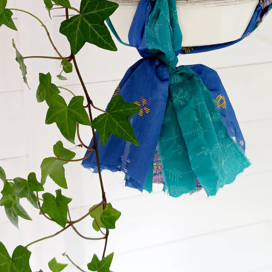 These beautiful sari plant hangers will add a splash of colour and boho chic to your home. Made from scraps of used sari, their simple design ensures that no fabric is wasted but is re-purposed into an elegant product. Featuring a strong metal ring for hanging.