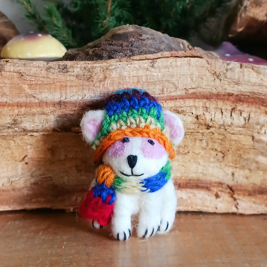 Bring instant festive cheer to your home with this adorable Christmas Tree Rabbit Decoration. Dressed in a hand-knitted rainbow hat and matching scarf, this charming little bunny captures the magic of the season at first sight. Its sweet black nose, expressive eyes, and cartoon-like ears bring out the childlike joy in anyone who sees it.
