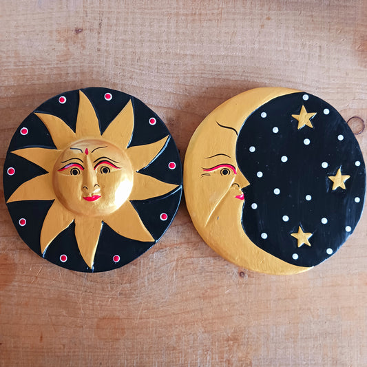 Bring a burst of sunshine into your home with this Black and Gold Sun Plaque, lovingly hand-carved in Bali from sustainably sourced wood. Each plaque features a radiant sun face surrounded by detailed rays, symbolizing warmth, vitality, and the cycles of life.