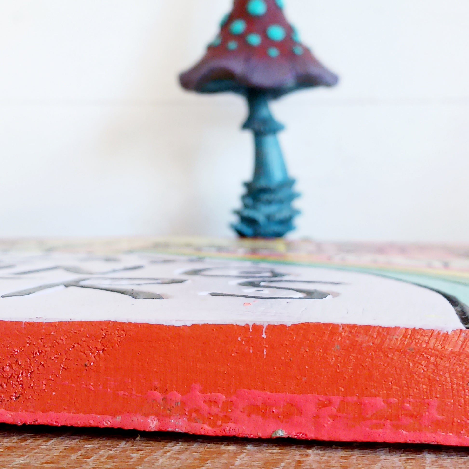 Add a splash of colour and carefree charm to your space with this Relax Nothing Matters Wall Plaque. Handmade by skilled artisans in Indonesia, this standout piece features a vibrant rainbow and whimsical mushroom in an abstract design.