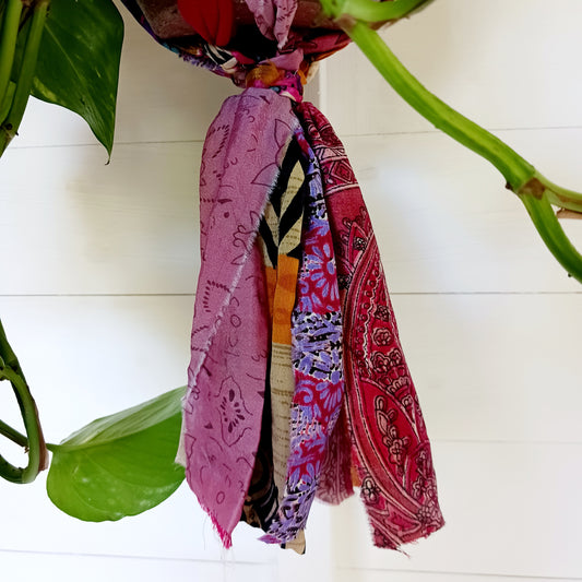Add a burst of colour and a touch of boho charm to your home with these beautiful Large Recycled Sari Plant Hangers. Each hanger is handcrafted from upcycled sari fabric, giving new life to discarded textiles while ensuring no material goes to waste. Their simple yet elegant design allows them to complement any décor style, from minimal to eclectic. Featuring a sturdy metal ring for easy hanging, they are perfect for showcasing your favourite indoor plants in a sustainable and stylish way.