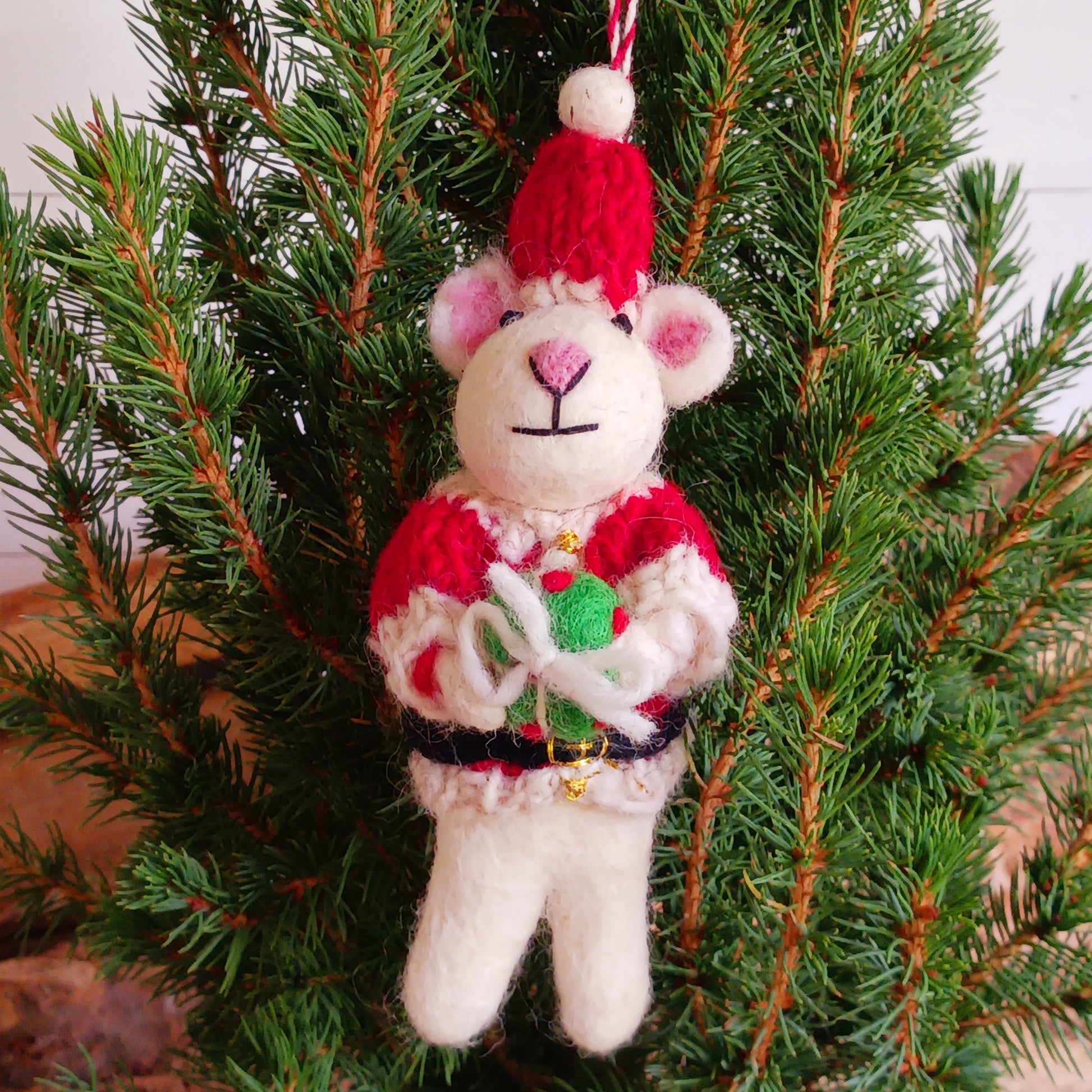 Meet our endearing little Christmas mice, dressed in vibrant Santa knitwear, donning a classic Santa outfit ready to spread festive cheer. Each ornament is lovingly handcrafted, capturing the magic and childlike wonder of the holiday season.