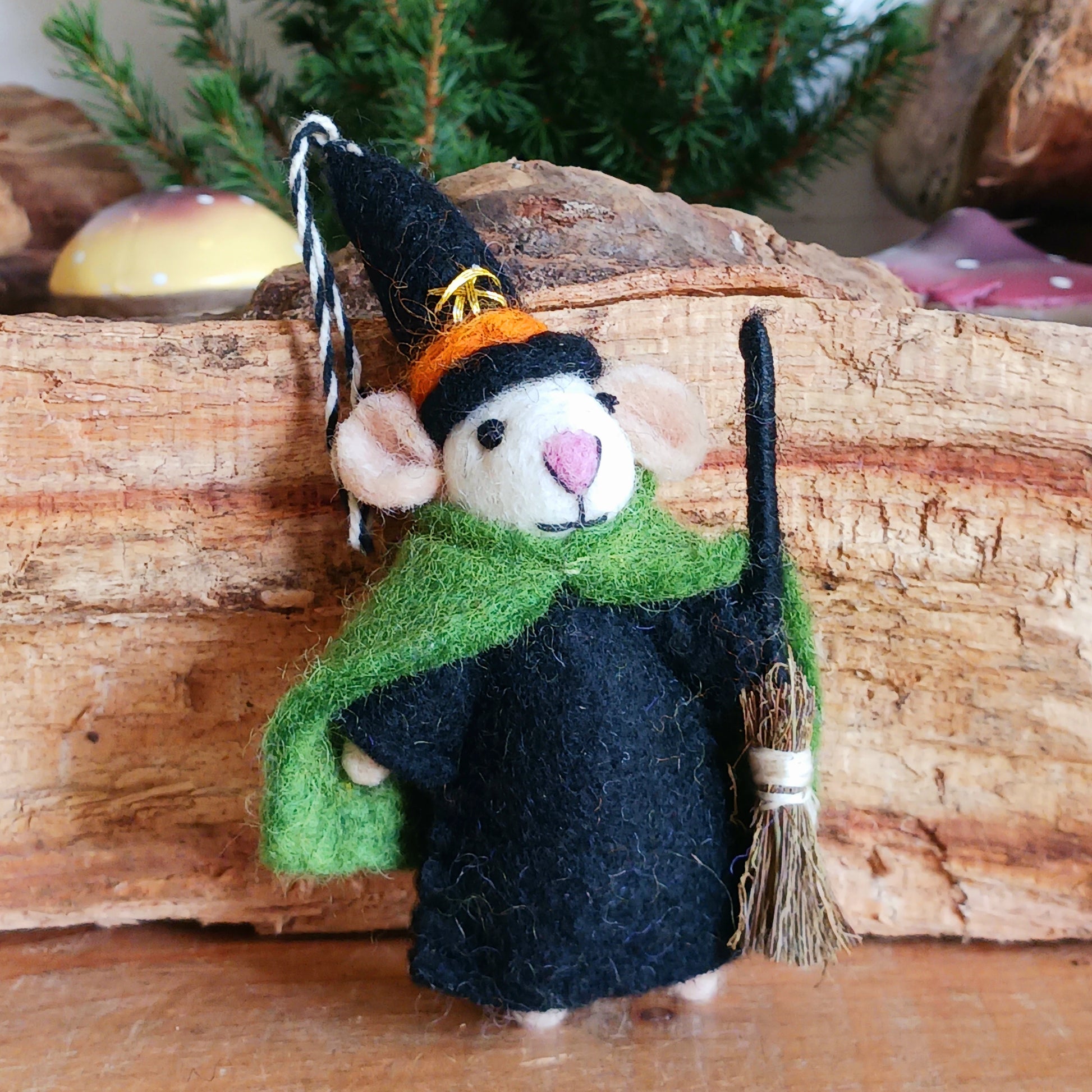 Bring a touch of handcrafted Halloween charm to your home with these delightful felted mice dressed as a Witch character. Each mouse features adorable details including long tails, soft pink ears and noses, and colourful pointed hats and capes. The Witch style is elegantly finished with gold star embroidery for extra magical flair, complete with little broomstick.