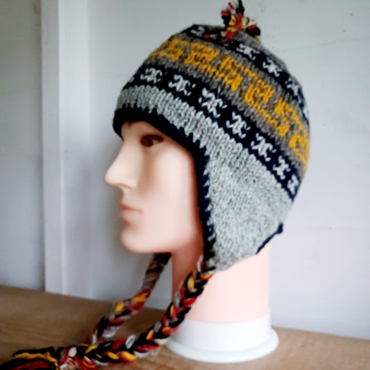 Stay cozy and stylish with our handmade chunky wool earflap hats, crafted in Nepal by skilled women artisans in Kathmandu. Each hat is 100% pure wool and features a soft polar fleece lining for extra warmth and comfort. Perfect for cold winter days, outdoor adventures, or adding a touch of handmade charm to your look.
