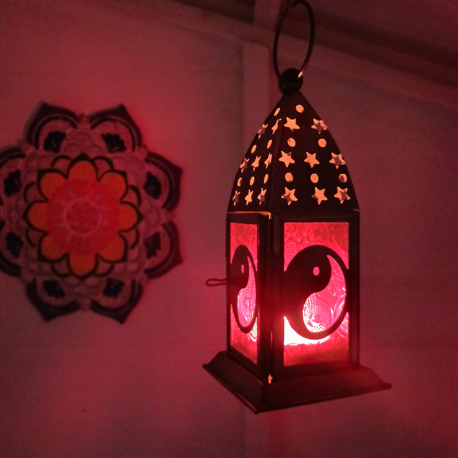 Bring warmth, colour and spiritual harmony to your home with this beautiful Yin Yang Glass Lantern. Designed with vibrant coloured glass panels and a decorative metal cut-out canopy, this lantern creates a calming glow that enhances meditation spaces, yoga rooms and home décor.