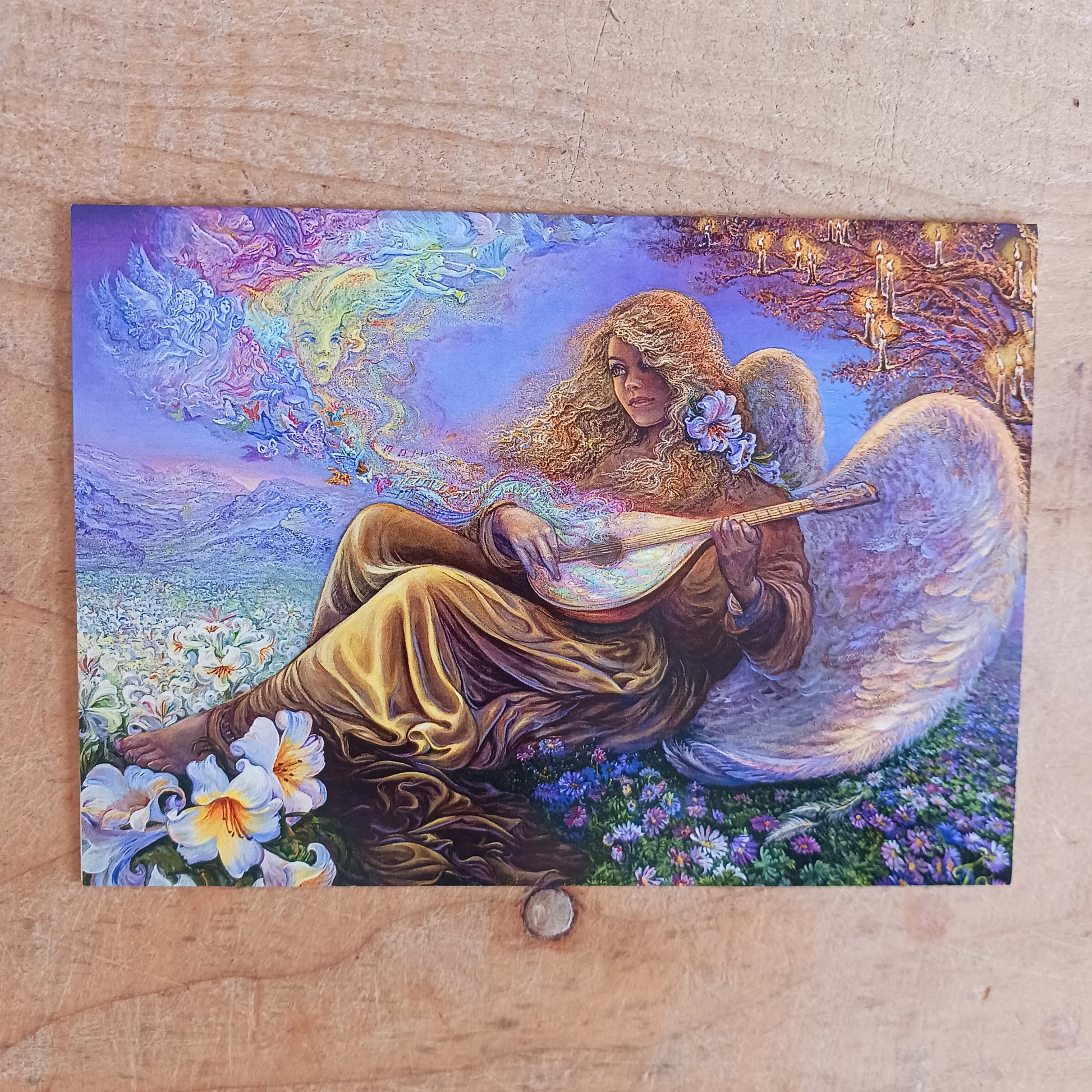 This beautiful greetings card entitled Angel Melodies is designed by Josephine Wall. The card is blank inside for you to write your own message. Each envelope is decorated with pretty artwork too. Perfect for any occasion.