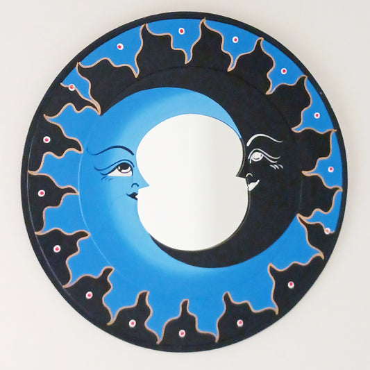 Transform your space with the enchanting Dark &amp; Light Moon Mirror. Designed with a striking dark blue and black painted wooden frame, this mirror blends whimsy and mystery to create an eye-catching focal point in any room. Perfect for adding a dreamy, celestial vibe, it reflects light beautifully while inspiring imagination and creativity. Whether hung in a bedroom, living room, or creative space, this moon mirror invites serenity and wonder into your home décor.