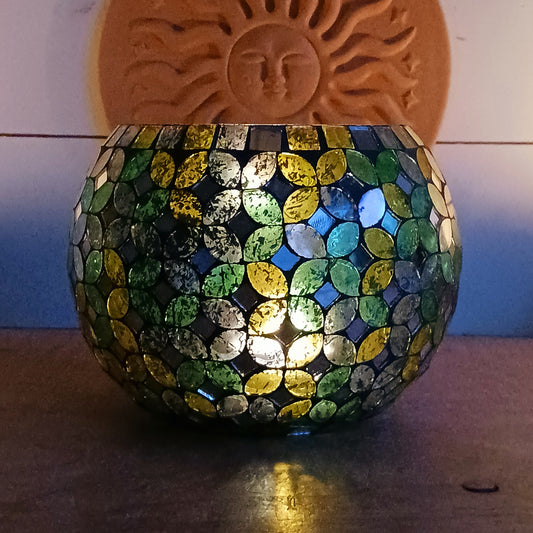 Add a warm, colourful glow to your home with this large and beautiful handmade Meena mosaic glass tealight holder, crafted by a World Fair Trade Organisation (WFTO) approved supplier in India.